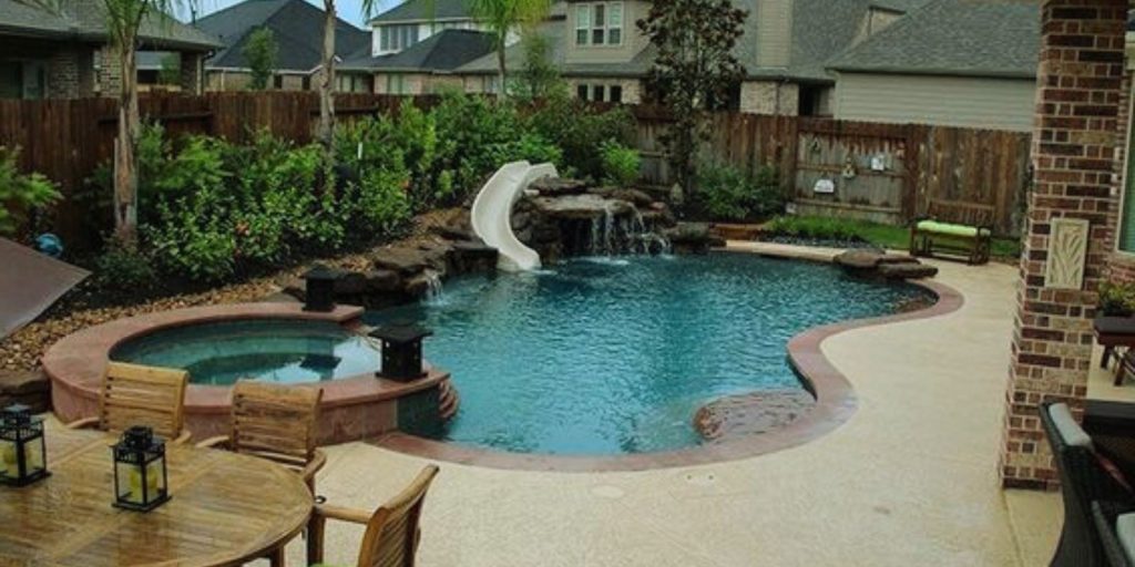 A Spool pool with a fountain in an outdoor setting