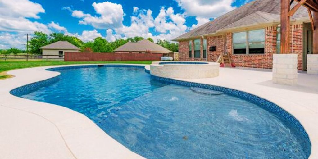 Blue Shades pool in surrounded with cottages