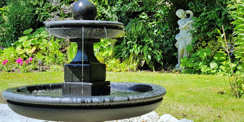  A classic water fountain in a garden setting. 