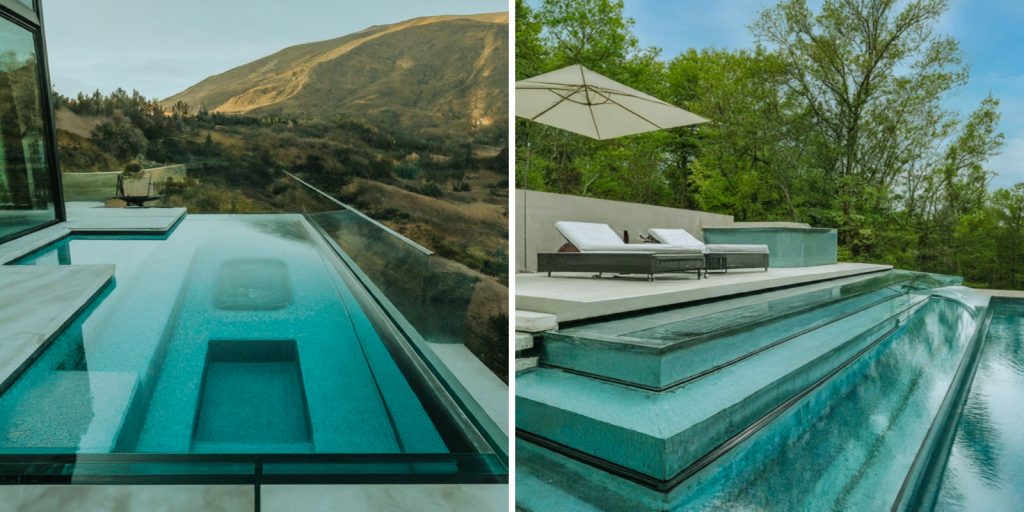 A pool with a deck overlooking a mountain in the background.