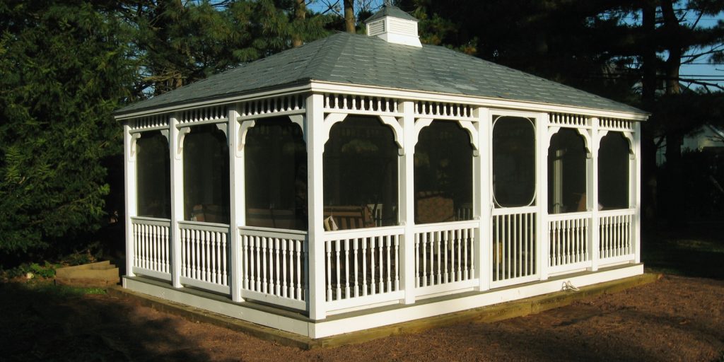 A rectangular gazebo surrounded by trees