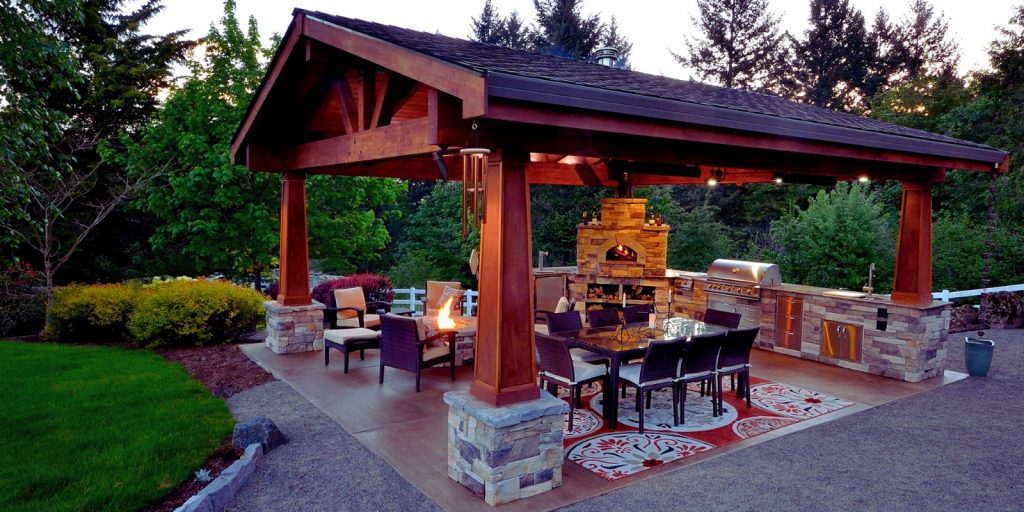  A gazebo with a patio area and chairs.