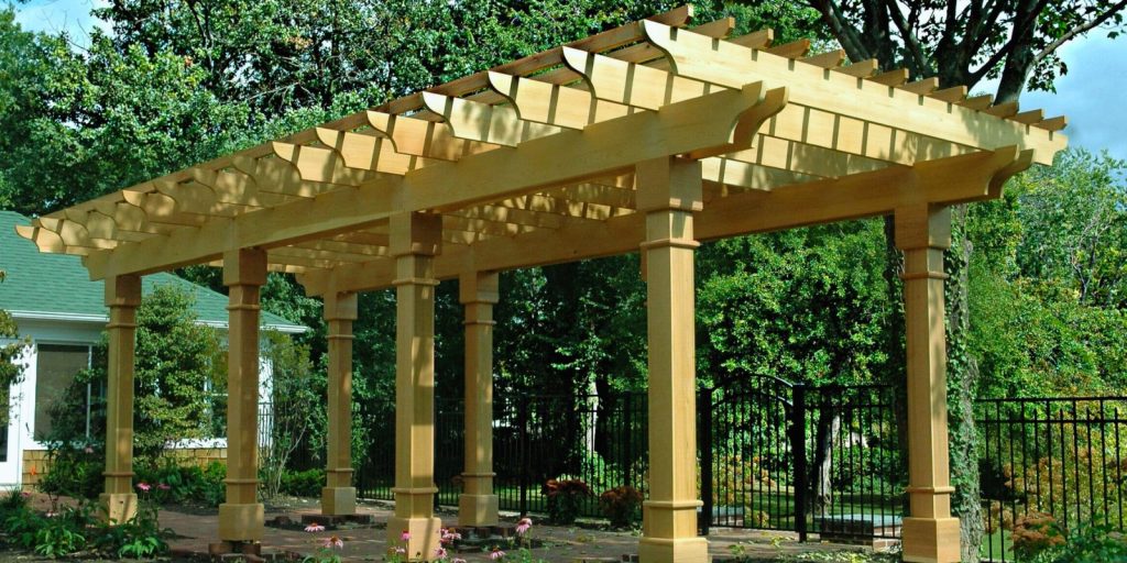 A large classic pergola wooden structure with columns