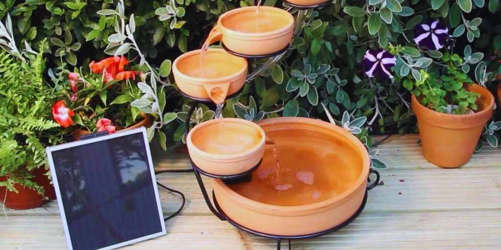 A group of potted plants with solar plate