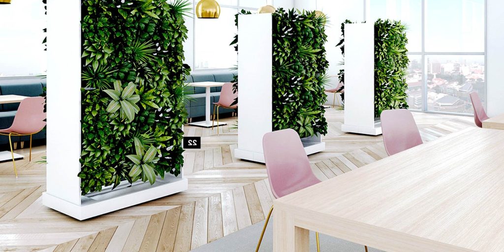 Modern Office, with artificial grass wall and chairs in a room.