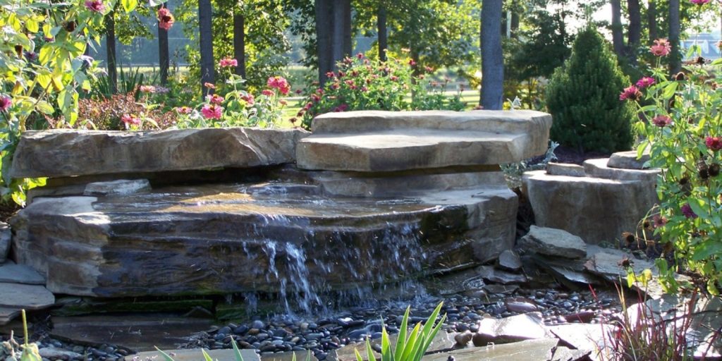 A natural fountain pond in a garden