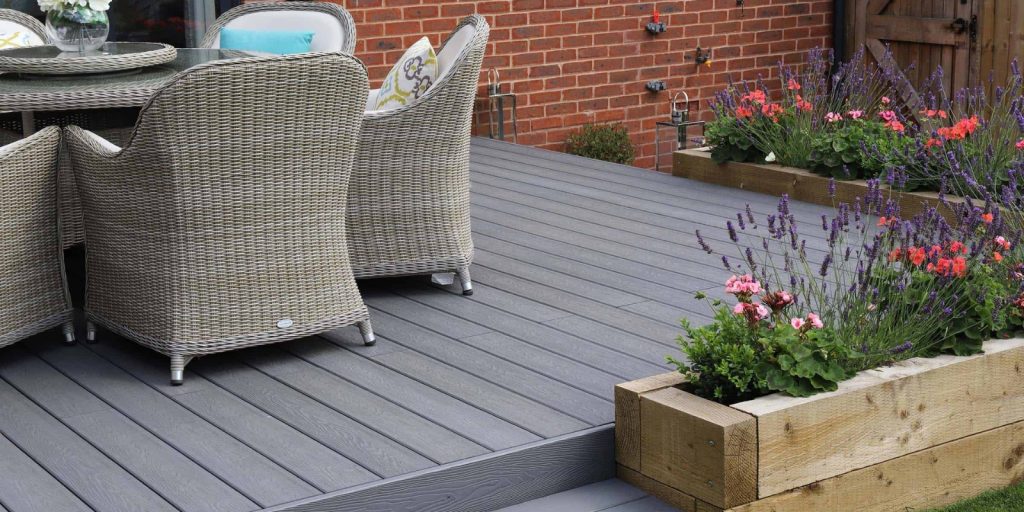  A chair situated on a deck, surrounded by outdoor elements